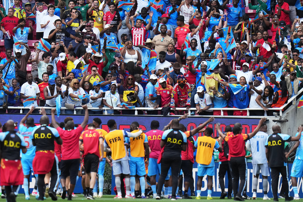 DR Congo's players and fans celebrate at the end of the World Cup playoff final soccer match between DR Congo and Jamaica in Guadalajara, Mexico, Tuesday, March 31, 2026. (AP Photo/Eduardo Verdugo)