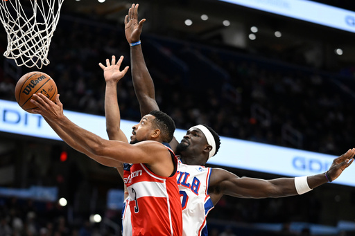 Washington Wizards guard CJ McCollum, left, rises past Philadelphia 76ers center Adem Bona for a basket during the first half of an NBA basketball game Tuesday, Oct. 28, 2025, in Washington. (AP Photo/John McDonnell) Washington Wizards guard CJ McCollum, left, rises past Philadelphia 76ers center Adem Bona for a basket during the first half of an NBA basketball game Tuesday, Oct. 28, 2025, in Washington. (AP Photo/John McDonnell)