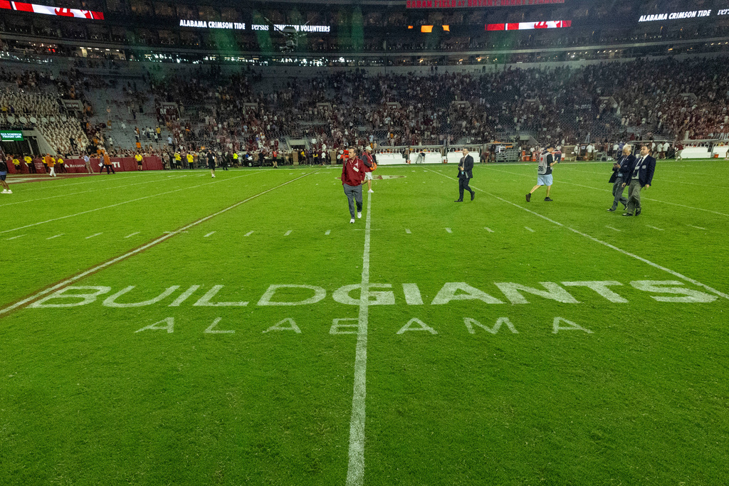 The University of Alabama partnered with the U.S. Navy's Maritime Industrial Base program to add "Build Giants Alabama" logos on both 25-yard lines, seen after Alabama's 37-20 win over Tennessee at an NCAA college football game, Saturday, Oct. 18, 2025, in Tuscaloosa, Ala. (AP Photo/Vasha Hunt)