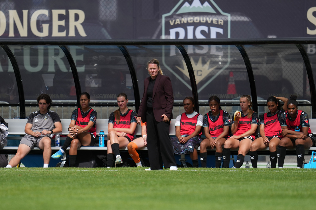FILE - Vancouver Rise FC head coach Anja Heiner-Moller watches play during a NSL match against Toronto AFC in Burnaby, British Columbia, June 28, 2026. (AP Photo/Abbie Parr, File)