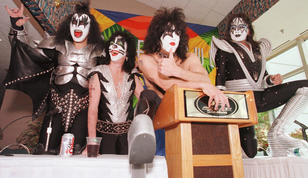 FILE - Members of the rock group Kiss, from left, Gene Simmons, Peter Criss, Paul Stanley and Ace Frehley, pose for pictures during a news conference Friday, Jan. 29, 1999, at Pro Player Stadium in Miami. (AP Photo/Ron Heflin, File)
