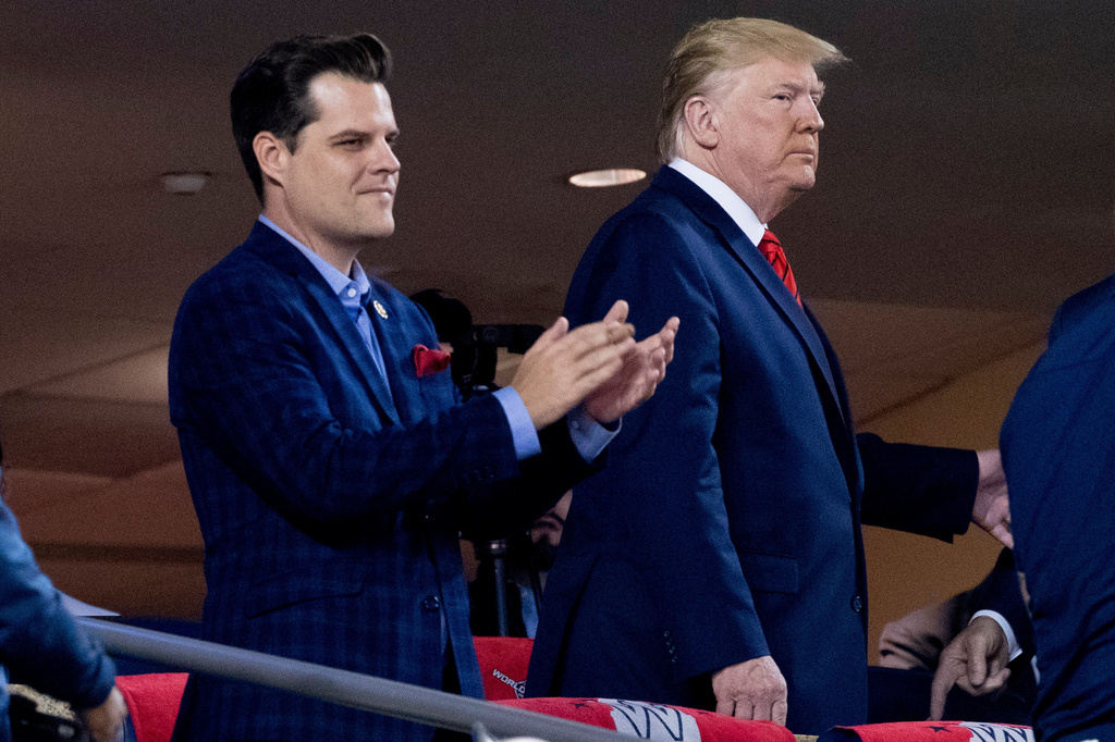 FILE - President Donald Trump, right, accompanied by Rep. Matt Gaetz, R-Fla., left, arrive for Game 5 of the World Series baseball game between the Houston Astros and the Washington Nationals at Nationals Park in Washington, Oct. 27, 2019. (AP Photo/Andrew Harnik, File)