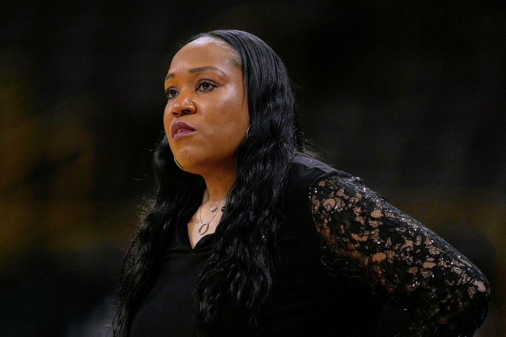 FILE - Virginia head coach Amaka Agugua-Hamilton watches from the bench during the first half in a First Four college basketball game against Arizona State in the NCAA Tournament, March 19, 2026, in Iowa City, Iowa. (AP Photo/Charlie Neibergall, File)