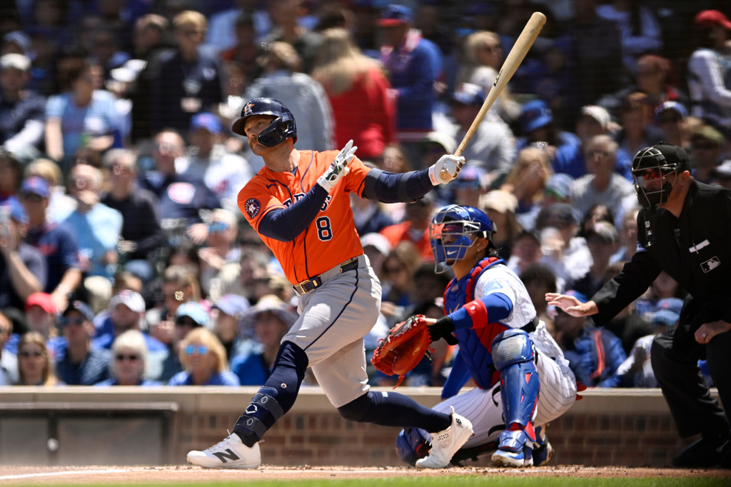 Houston Astros' Christian Walker (8) watches his two-run home run during the first inning of a baseball game against the Chicago Cubs in Chicago, Saturday, May 23, 2026. (AP Photo/Paul Beaty)