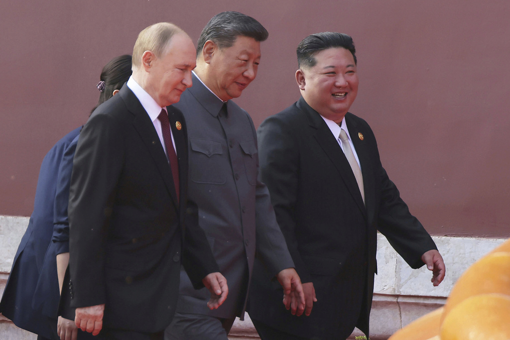 In this photo provided by the North Korean government, Russian President Vladimir Putin, from left, Chinese President Xi Jinping and North Korean leader Kim Jong Un walk to attend a military parade marking the 80th anniversary of the end of World War II at the Tiananmen Square in Beijing Wednesday, Sept. 3, 2025. Independent journalists were not given access to cover the event depicted in this image distributed by the North Korean government. The content of this image is as provided and cannot be independently verified. (Korean Central News Agency/Korea News Service via AP)