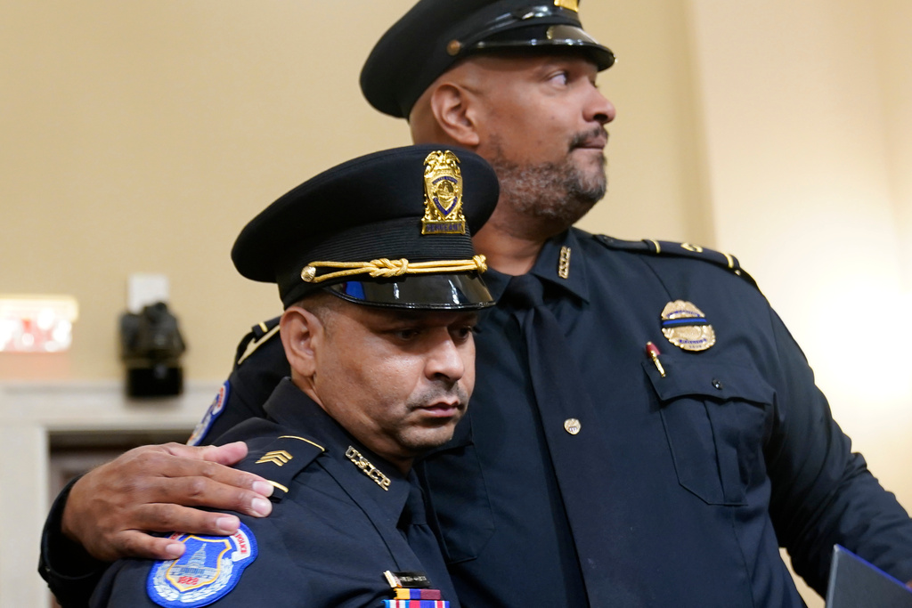 FILE - U.S. Capitol Police Sgt. Aquilino Gonell left, and U.S. Capitol Police Sgt. Harry Dunn stand after a House select committee hearing on the Jan. 6 attack on Capitol Hill in Washington, July 27, 2021. (AP Photo/ Andrew Harnik, Pool, File)