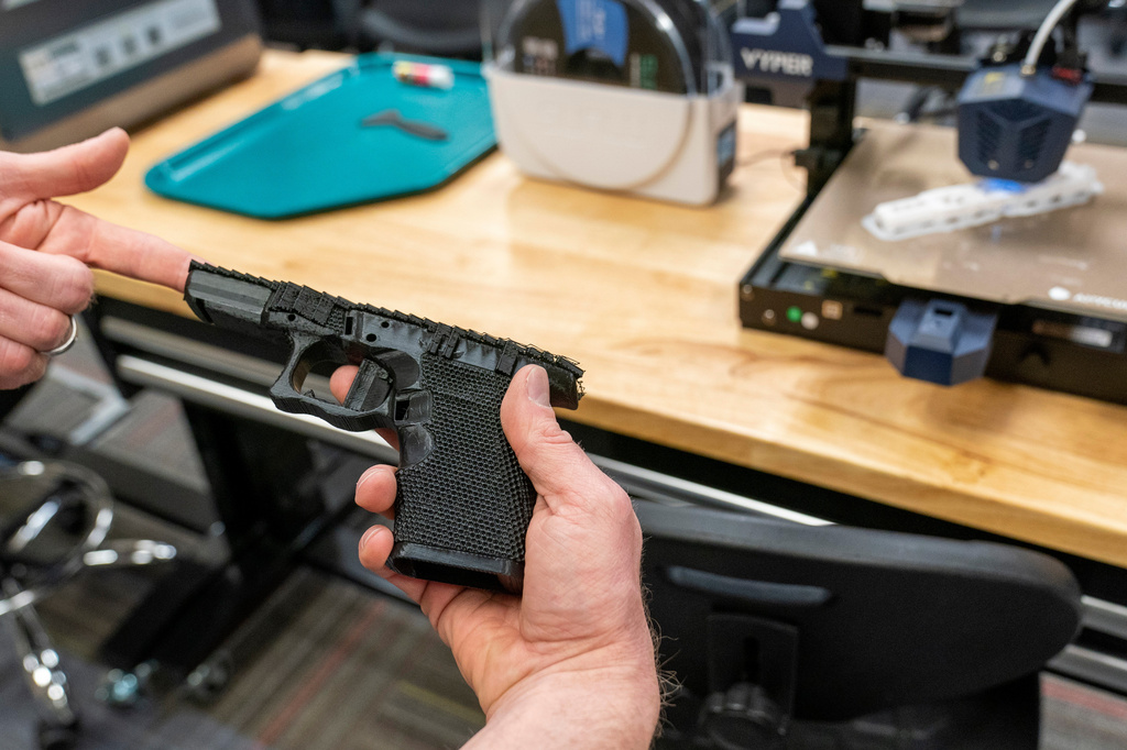 FILE - A handgun frame that has been printed on a 3D printer is held for a photograph at the Bureau of Alcohol, Tobacco, Firearms, and Explosives (ATF), National Services Center, March 2, 2023, in Martinsburg, W.Va. (AP Photo/Alex Brandon, File)