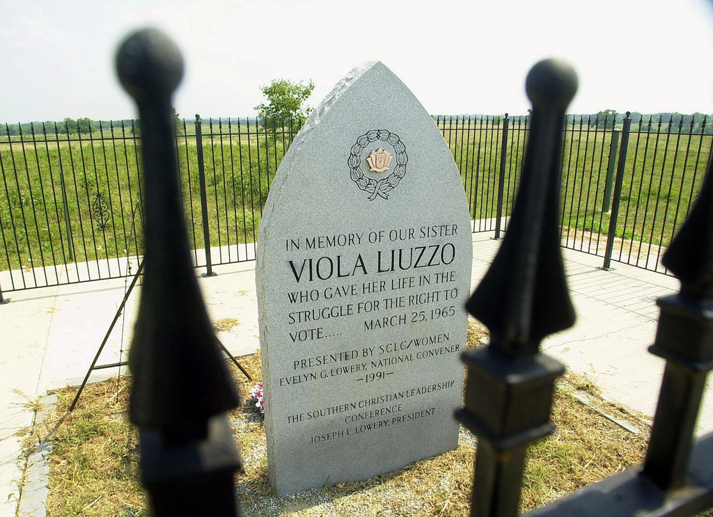 FILE - An iron fence surrounds the memorial to civil rights activist Viola Liuzzo on Friday, July 7, 2000, near Lowndesboro, Ala., on U.S. 80. (AP Photo/Dave Martin, File)