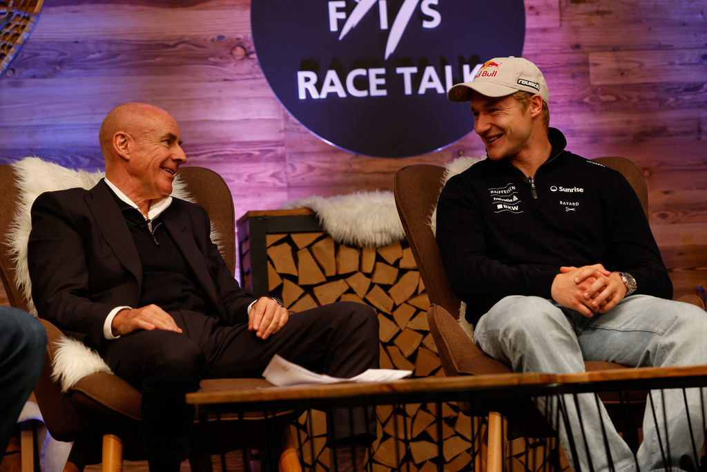 FIS (International Ski Federation) President, Johan Eliasch, left, and Switzerland's Marco Odermatt meet the media ahead of the alpine ski, World Cup opening races, in Soelden, Austria, Friday, Oct. 24, 2025. (AP Photo/Alessandro Trovati)