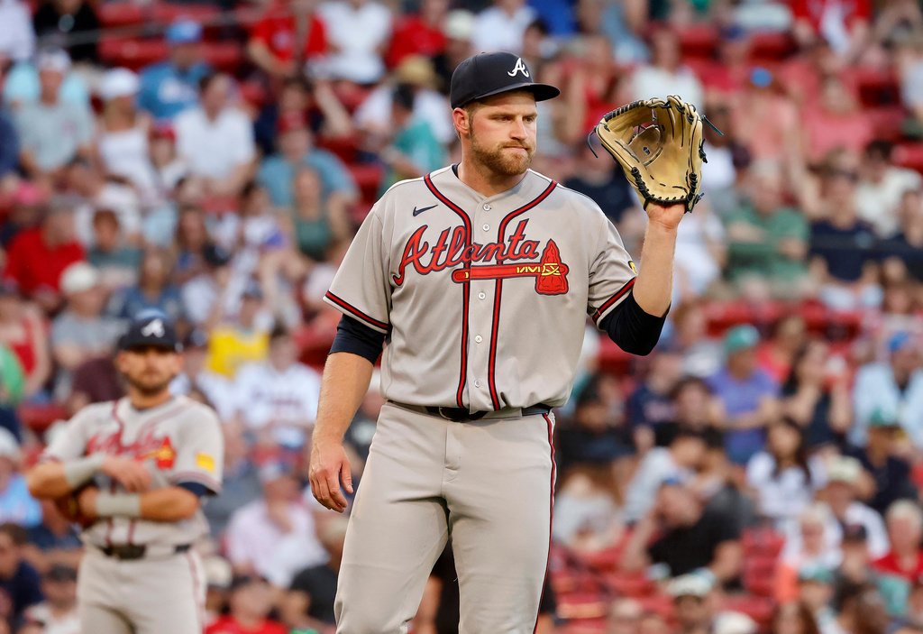 Atlanta Braves starting pitcher Bryce Elder (55) reacts after committing a throwing error during the second inning of a baseball game against the Boston Red Sox at Fenway Park, Wednesday, May 27, 2026, in Boston. (AP Photo/Mary Schwalm)