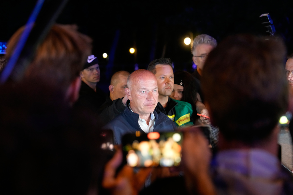 Mayor Kai Wegner speaks to the media in Berlin, early Sunday, July 26, 2026, following the cancellation of Christopher Street Day festivities. (AP Photo/Markus Schreiber)