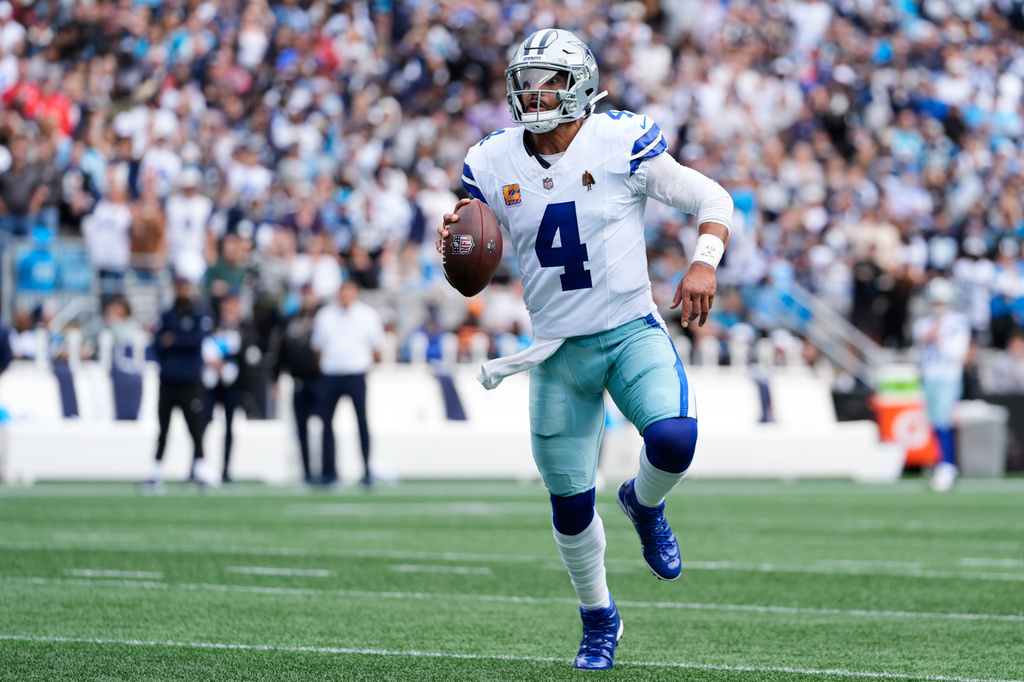 Dallas Cowboys quarterback Dak Prescott looks to throw a pass in the first half of an NFL football game against the Carolina Panthers, Sunday, Oct. 12, 2025, in Charlotte, N.C. (AP Photo/Erik Verduzco)