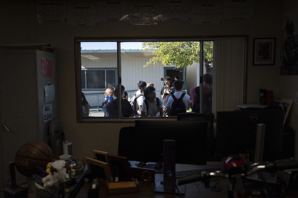 Students wait outside English teacher Casey Cuny's classroom at Valencia High School in Santa Clarita, Calif., Wednesday, Aug. 27, 2025. (AP Photo/Jae C. Hong)