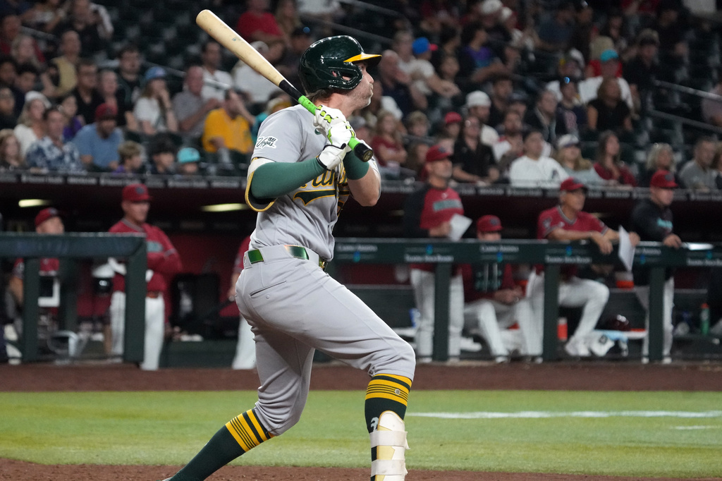 Athletics' Jeff McNeil hits a two-run single against the Arizona Diamondbacks in the seventh inning of a baseball game, Monday, July 20, 2026, in Phoenix. (AP Photo/Rick Scuteri)