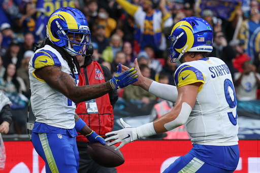 Los Angeles Rams wide receiver Davante Adams (17) celebrates with Los Angeles Rams quarterback Matthew Stafford (9) after scoring a touchdown during the first half of an NFL football game between the Los Angeles Rams and the Jacksonville Jaguars in London, Sunday, Oct. 19, 2025. (AP Photo/Ian Walton) Los Angeles Rams wide receiver Davante Adams (17) celebrates with Los Angeles Rams quarterback Matthew Stafford (9) after scoring a touchdown during the first half of an NFL football game between the Los Angeles Rams and the Jacksonville Jaguars in London, Sunday, Oct. 19, 2025. (AP Photo/Ian Walton)