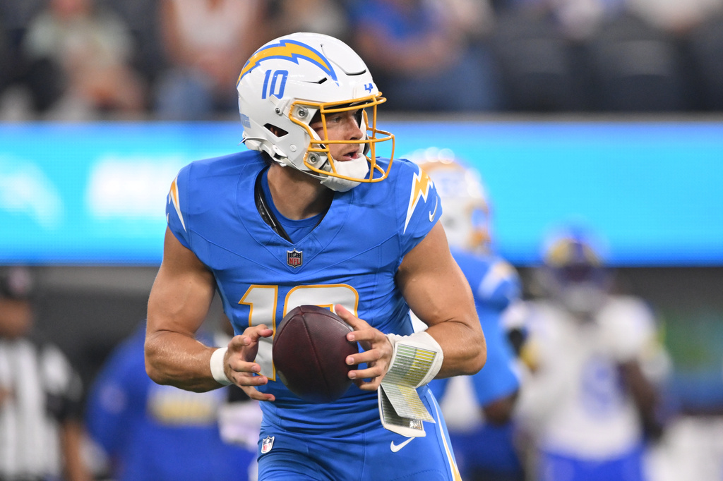 Los Angeles Chargers quarterback Justin Herbert drops back to pass during the first half of an NFL preseason football game against the Los Angeles Rams Thursday, Aug. 27, 2026, in Inglewood, Calif. (AP Photo/Katie Chin)