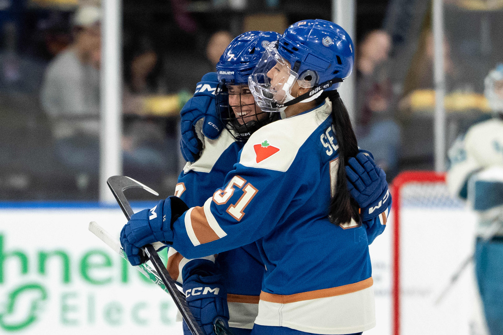 Vancouver Goldeneyes' Madison Samoskevich (7) celebrates her first goal with Anna Segedi (51) during the second period of a PWHL hockey game against the Seattle Torrent in Vancouver, British Columbia, Tuesday, April 14, 2026. (Ethan Cairns/The Canadian Press via AP)