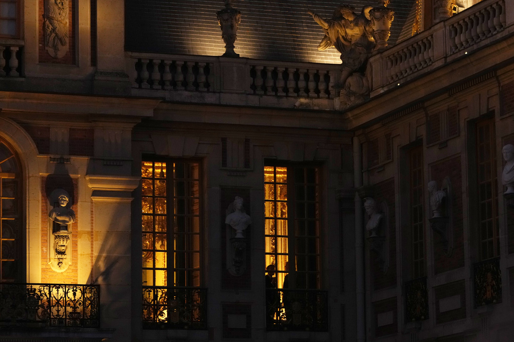 President Donald Trump and French President Emmanuel Macron are silhouetted inside the Palace of Versailles, Wednesday, June 17, 2026, in Versailles, France. (AP Photo/Julia Demaree Nikhinson)