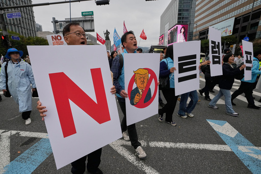 FILE - South Korean protesters march during a rally against U.S. President Donald Trump's tariffs policy on South Korea, in Seoul, South Korea, Oct. 18, 2025. The signs read "No Trump." (AP Photo/Ahn Young-joon, File) FILE - South Korean protesters march during a rally against U.S. President Donald Trump's tariffs policy on South Korea, in Seoul, South Korea, Oct. 18, 2025. The signs read "No Trump." (AP Photo/Ahn Young-joon, File)