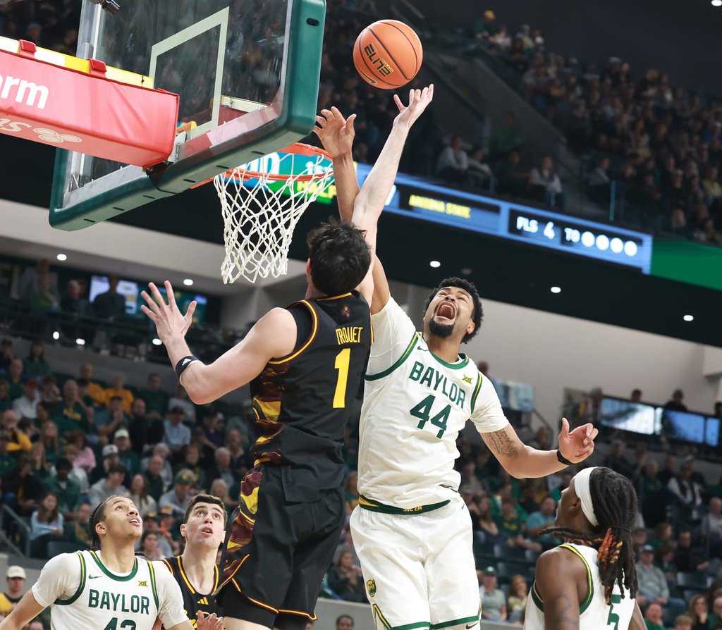 Baylor center Caden Powell (44) fouls Arizona State forward Santiago Trouet in the first half of an NCAA college basketball game, Saturday, Feb. 21, 2026, in Waco, Texas. (Rod Aydelotte/Waco Tribune-Herald via AP)