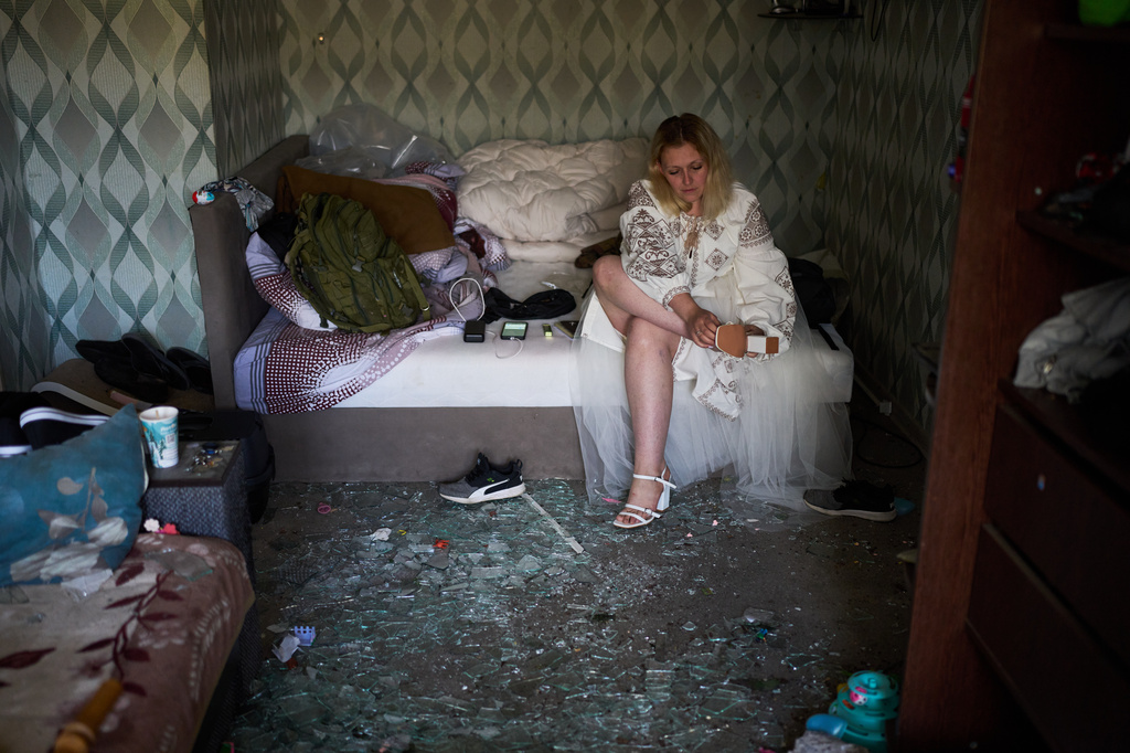 Liudmyla Ryzhak gets ready for her wedding to her fiancee Leonid Ryzhak in their damaged apartment, following a Russian missile and drone attack in Kyiv, Ukraine, Tuesday, Sept. 8, 2026. (AP Photo/Francisco Seco)