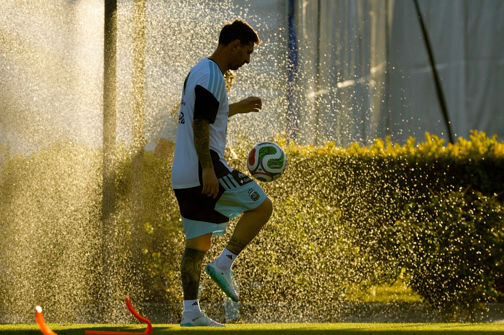 Argentina's Lionel Messi warms up during a training session ahead of an international friendly match against Mauritania, at the Argentina Soccer Association in Buenos Aires, Argentina, Wednesday, March 25, 2026. (AP Photo/Gustavo Garello)
