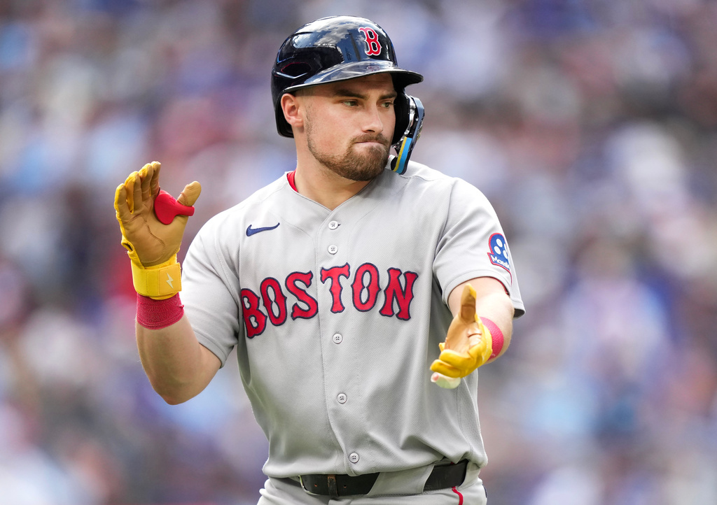 Boston Red Sox third baseman Caleb Durbin (5) reacts after hitting a grand slam against the Toronto Blue Jays during the eighth inning of a baseball game in Toronto, Thursday, Aug. 13, 2026. (Nathan Denette/The Canadian Press via AP)