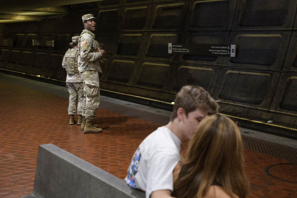 Members of the South Carolina National Guard patrol the platform of the Washington Metro Gallery Place station in Washington, Sunday, Aug. 24, 2025. (AP Photo/Rod Lamkey, Jr.)