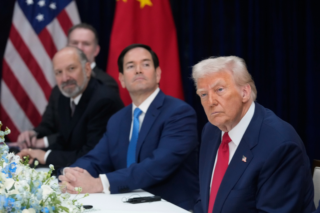 President Donald Trump, right, with Secretary of State Marco Rubio, second right, and Commerce Secretary Howard Lutnick, third right, meets with Chinese President Xi Jinping at Gimhae International Airport in Busan, South Korea, Thursday, Oct. 30, 2025. (AP Photo/Mark Schiefelbein)