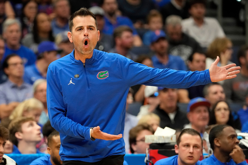 Florida head coach Todd Golden talks to an official during the first half in the first round of the NCAA college basketball tournament against Prairie View A M Friday, March 20, 2026, in Tampa, Fla. (AP Photo/Chris O'Meara)