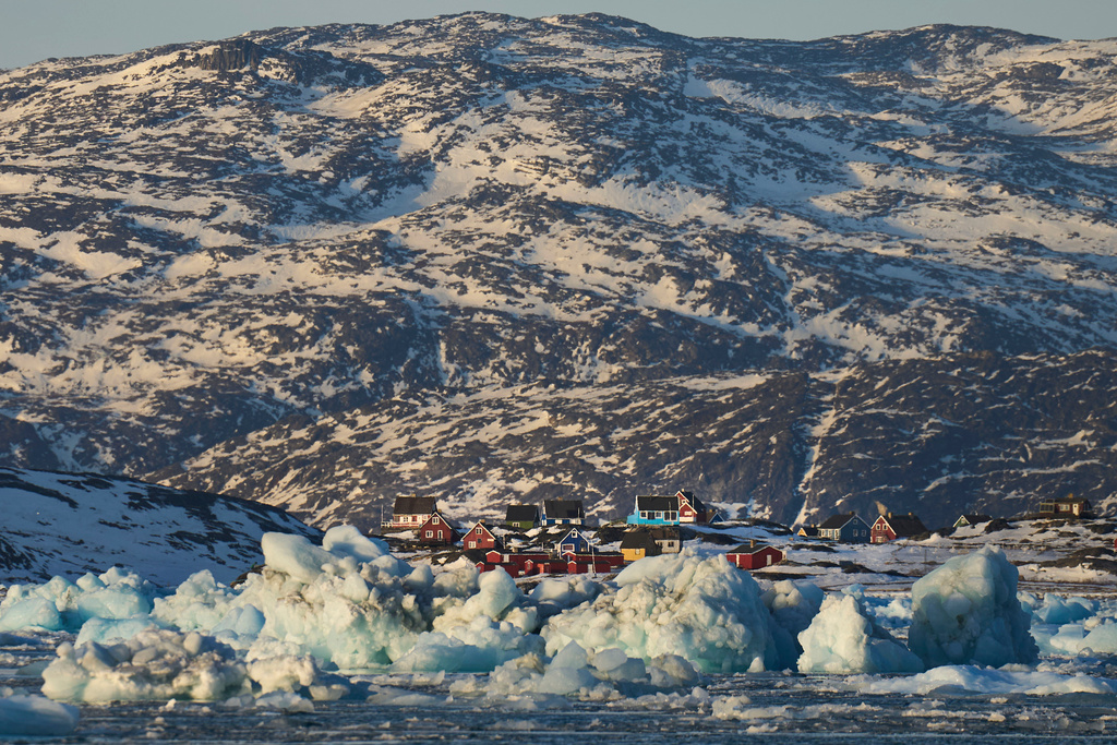 FILE - Pieces of ice move through the sea in Qoornoq Island, near Nuuk, Greenland, on Feb. 17, 2025. (AP Photo/Emilio Morenatti, File)