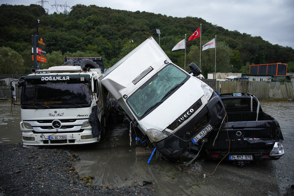 Vehicles lie scattered in the aftermath of flooding caused by heavy rains in Istanbul, Turkey, Thursday, Oct. 15, 2026. (AP Photo/Emrah Gurel)