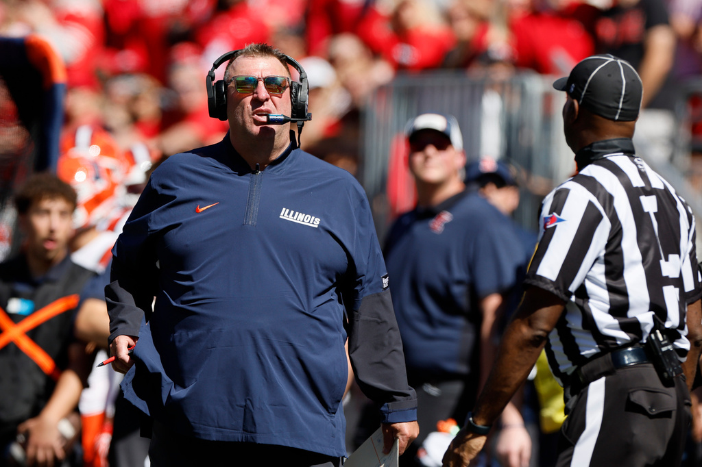 Illinois head coach Bret Bielema watches a replay during the first half of an NCAA college football game against Ohio State, Saturday, Sept. 26, 2026, in Columbus, Ohio. (AP Photo/Jay LaPrete)