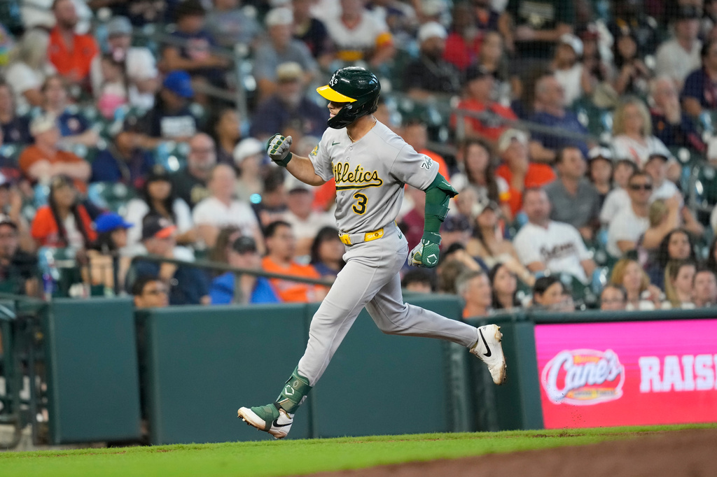 Athletics' Max Muncy celebrates after hitting a home run against the Houston Astros during the seventh inning of a baseball game Sunday, Aug. 23, 2026, in Houston. (AP Photo/David J. Phillip)
