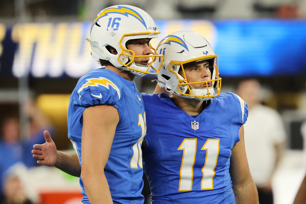 Los Angeles Chargers kicker Cameron Dicker (11) celebrates his field goal with place holder J.K. Scott during overtime of an NFL football game against the Philadelphia Eagles, Monday, Dec. 8, 2025, in Inglewood, Calif. (AP Photo/Kevork Djansezian)
