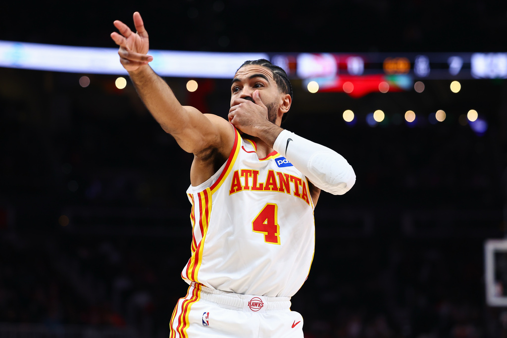 Atlanta Hawks guard Gabe Vincent reacts after a 3-pointer during the first half of an NBA basketball game against the Brooklyn Nets, Thursday, March 12, 2026, in Atlanta. (AP Photo/Colin Hubbard)