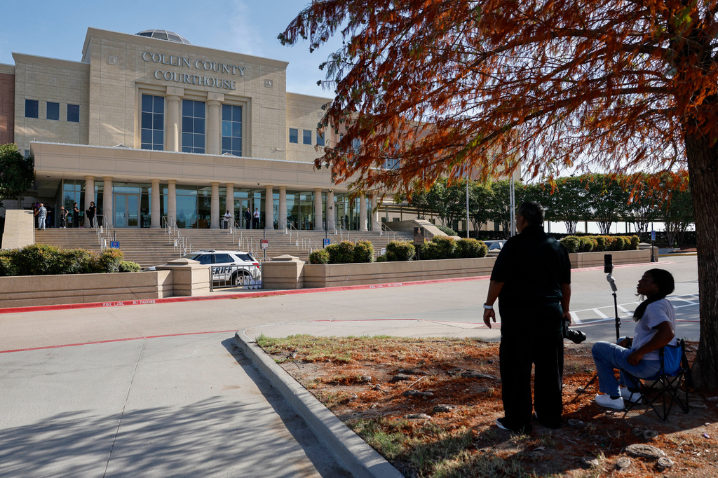 People gather outside the Collin County Courthouse on Wednesday, Aug. 19, 2026, in McKinney, Texas. (Elías Valverde II/The Dallas Morning News via AP)