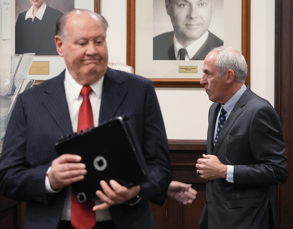 Defendants former FirstEnergy CEO Chuck Jones and ex-FirstEnergy Senior Vice President Michael Dowling enter the courtroom in Summit County Common Pleas Judge Susan Baker Ross' courtroom in Akron, Ohio, on Tuesday, March 31, 2026. (Mike Cardew /Akron Beacon Journal via AP, Pool)