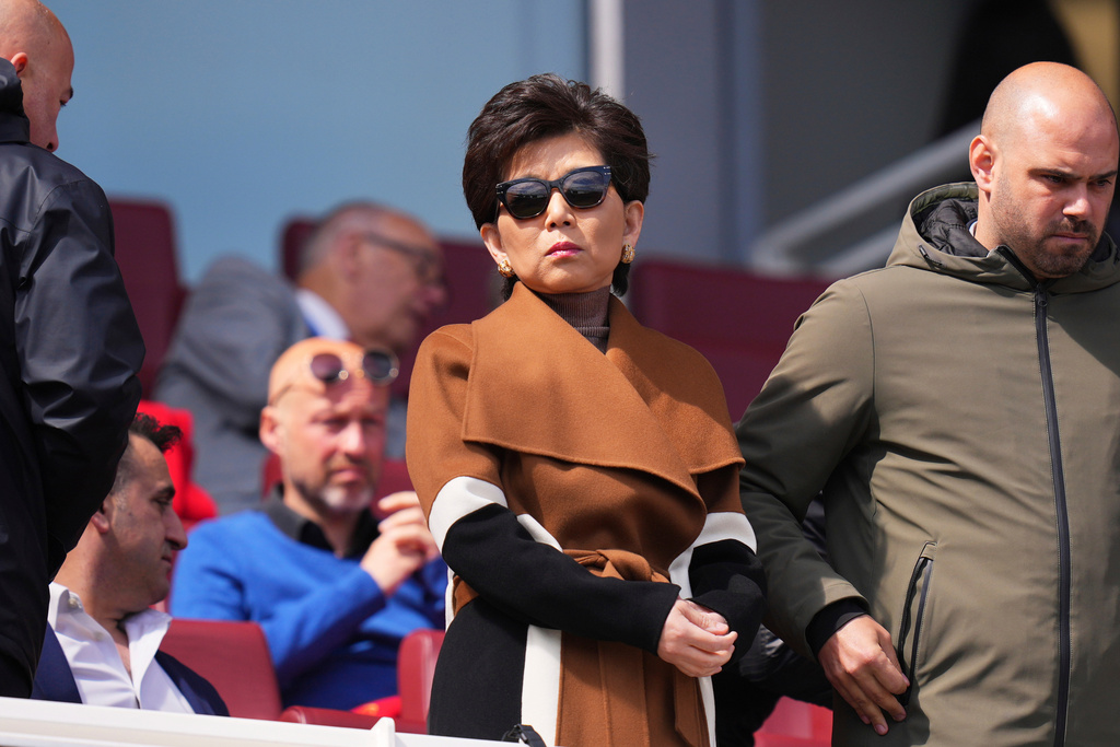 FILE - American businesswoman Michele Kang, owner of Olympique Lyonnais, on the tribune to watch the women's Champions League semifinals, first leg, soccer match between Arsenal FC and Olympique Lyonnais at the Arsenal Stadium, in London, April 19, 2025. (AP Photo/Kirsty Wigglesworth, File)