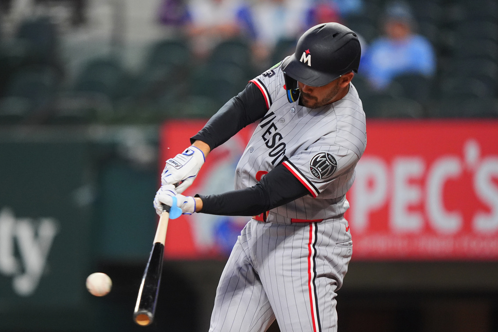 Minnesota Twins' Trevor Larnach hits a single during the first inning of a baseball game against the Texas Rangers, Thursday, June 18, 2026, in Arlington, Texas. (AP Photo/LM Otero)