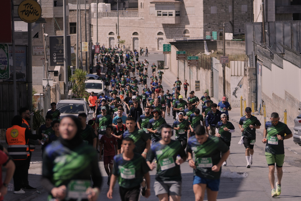 Runners participate in the Palestine Marathon in the West Bank city of Bethlehem, Friday, May 8, 2026. (AP Photo/Mahmoud Illean)