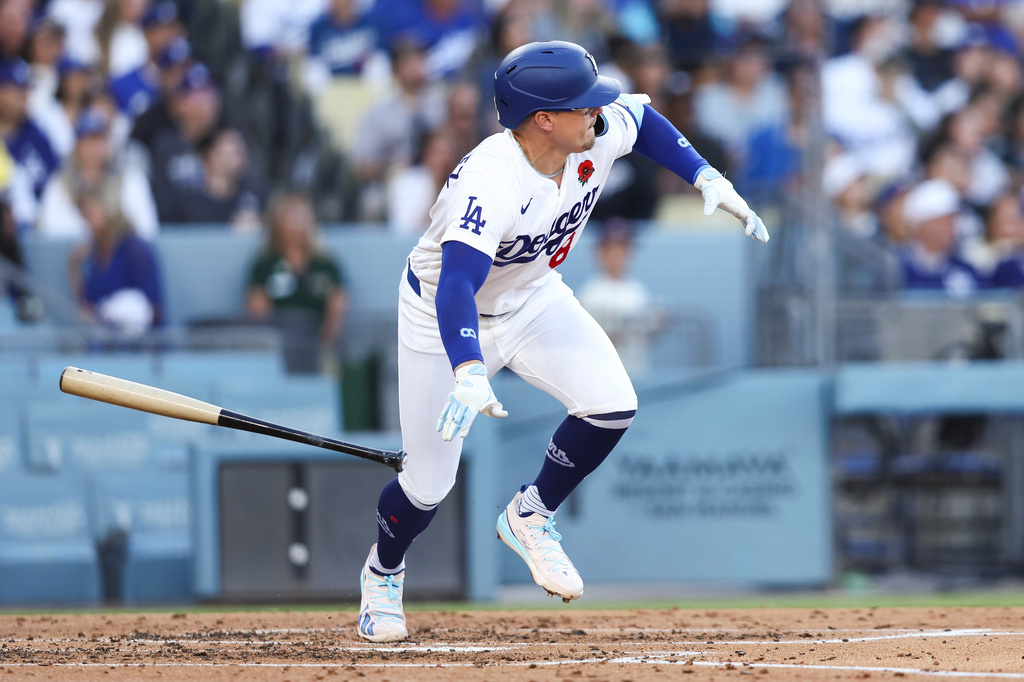 Los Angeles Dodgers' Enrique Hernández drops his bat after hitting an RBI double during the third inning of a baseball game against the Colorado Rockies, Monday, May 25, 2026, in Los Angeles. (AP Photo/Jessie Alcheh)