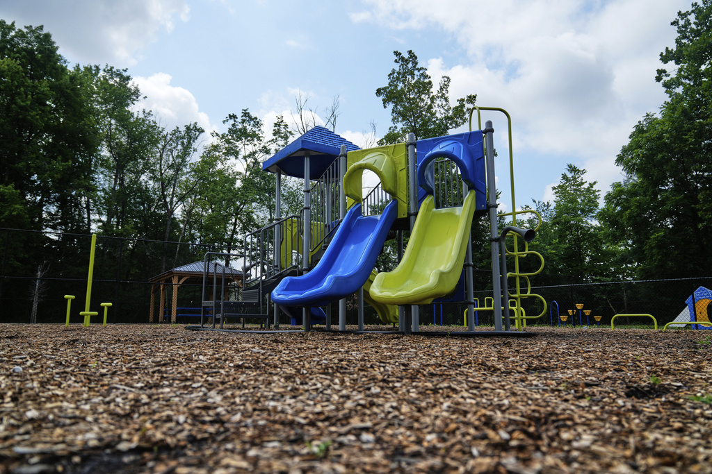 A playground stands on the property of the townhome where Maria Pires lived as a child, after being adopted from a Brazilian orphanage by Floyd Sykes III, stands in Baltimore, Monday, July 14, 2025. (AP Photo/Stephanie Scarbrough)