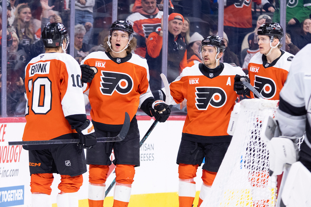 Philadelphia Flyers' Trevor Zegras, center left, celebrates his goal with teammates during the second period of an NHL hockey game against the Los Angeles Kings, Saturday, Jan. 31, 2026, in Philadelphia. (AP Photo/Chris Szagola)