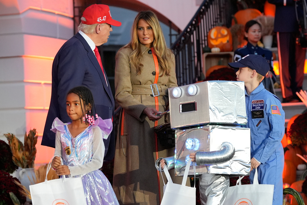 President Donald Trump and first lady Melania Trump participate in a Halloween at the White House event on the South Lawn, Thursday, Oct. 30, 2025, in Washington. (AP Photo/Alex Brandon)
