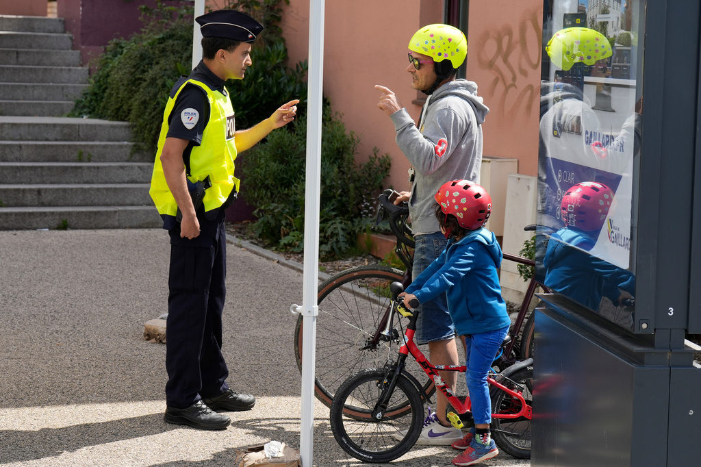 French police officers check people crossing the border between Geneva and the French town of Gaillard, France, Wednesday, June 10, 2026, ahead of the upcoming G7 summit due to take place June 15-17 in the town of Evian-les-Bains. (AP Photo/Baz Ratner)