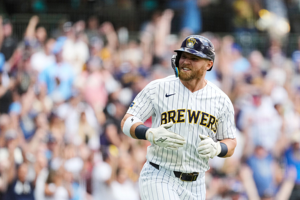 Milwaukee Brewers' Jake Bauers reacts as he rounds the bases after hitting a two-run home run during the third inning of a baseball game against the Atlanta Braves, Saturday, Aug. 22, 2026, in Milwaukee. (AP Photo/Aaron Gash)