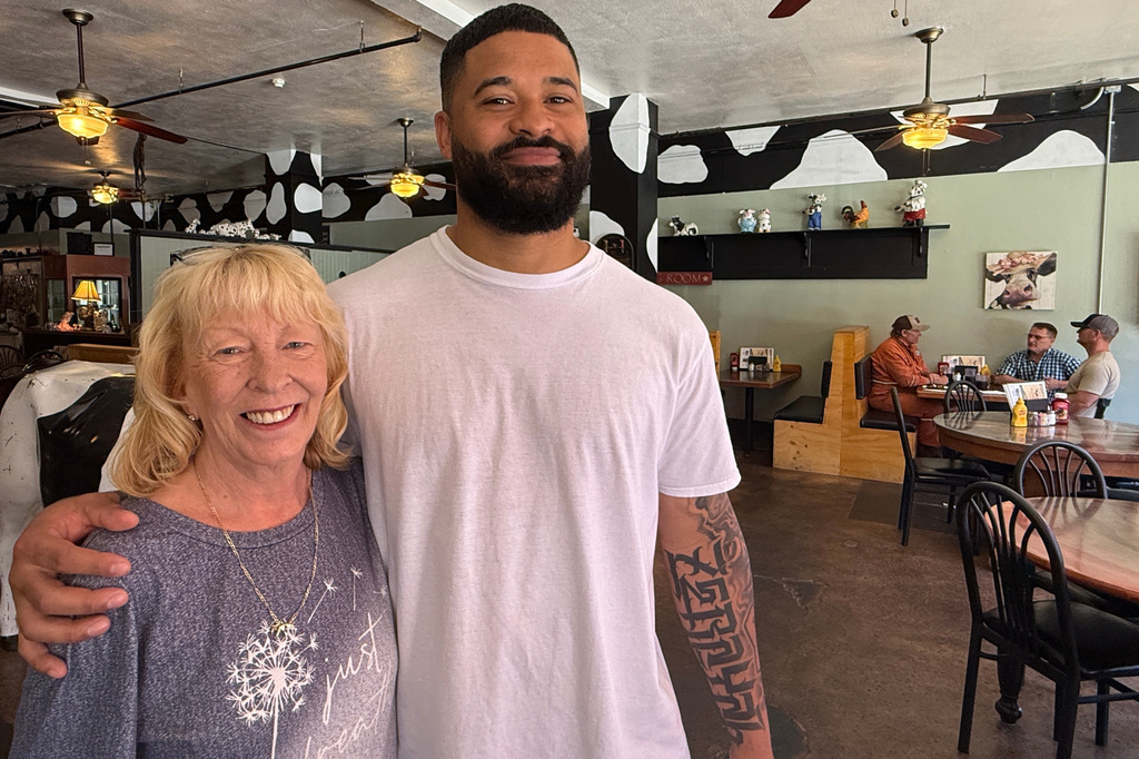 Jeray Key, manager of the Country Folks Deli in Longview, Wash., right, and Gayle Leavitt, a server at the restaurant, pose for a photo on May 27, 2026. (AP Photo/Claire Rush)