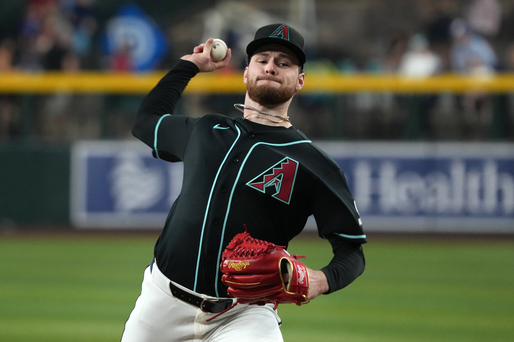 Arizona Diamondbacks pitcher Ryne Nelson throws against the Colorado Rockies in the first inning of a baseball game, Sunday, May 24, 2026, in Phoenix. (AP Photo/Rick Scuteri)