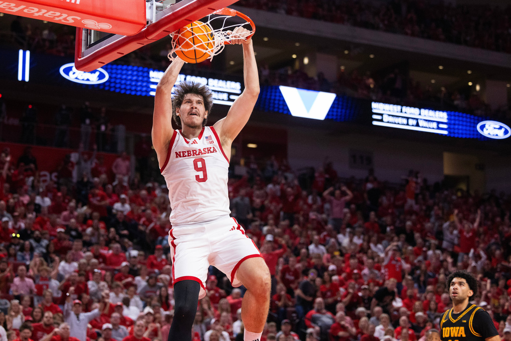 Nebraska's Berke Büyüktuncel (9) dunks against Iowa during the first half of an NCAA college basketball game, Sunday, March 8, 2026, in Lincoln, Neb. (AP Photo/Rebecca S. Gratz)